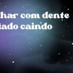Sonhar com dente cariado caindo